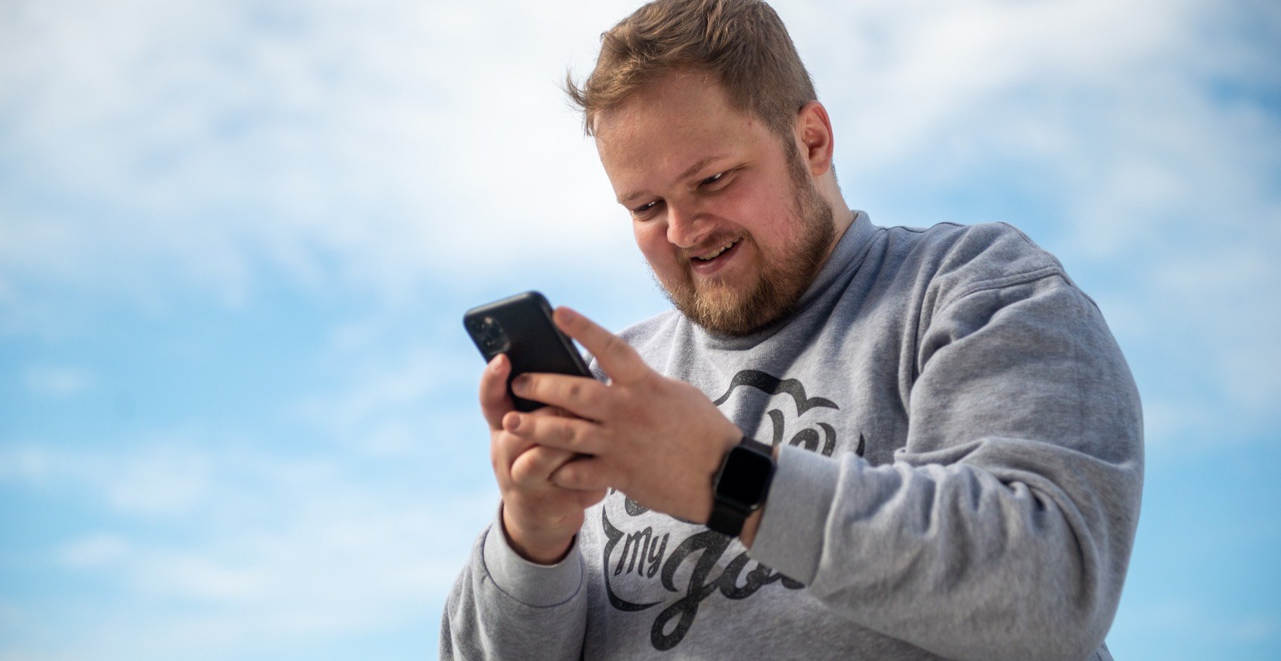 Tautvydas looking at his phone