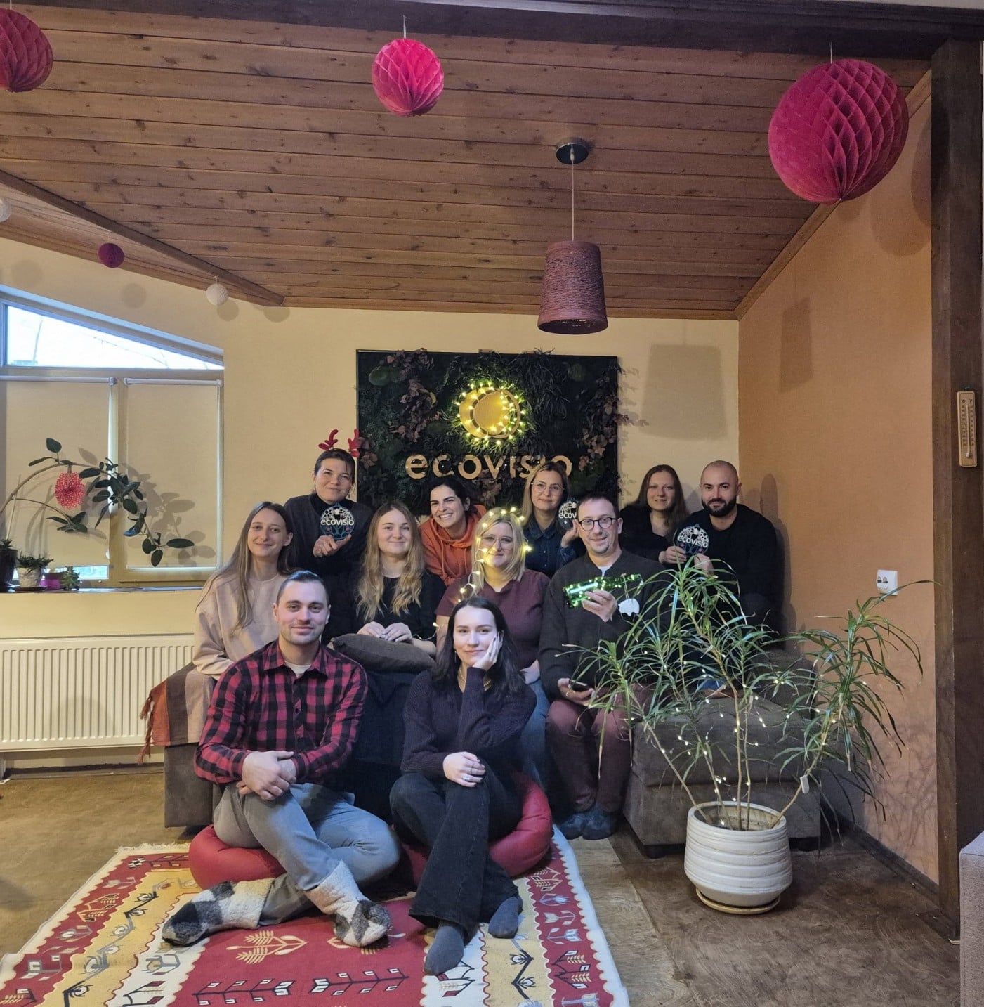 The EcoVisio team captured in a festive photo at the office