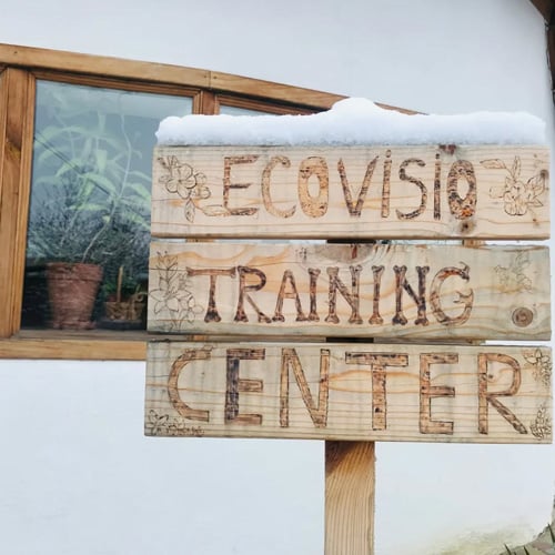 Image with the EcoVisio Training Center sign at EcoVillage Moldova