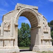 stone archway against trees and blue sky