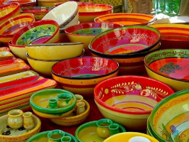 colourful ceramic bowls on sale in a market