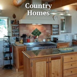 a large country kitchen with stainless steel stove and spices in racks