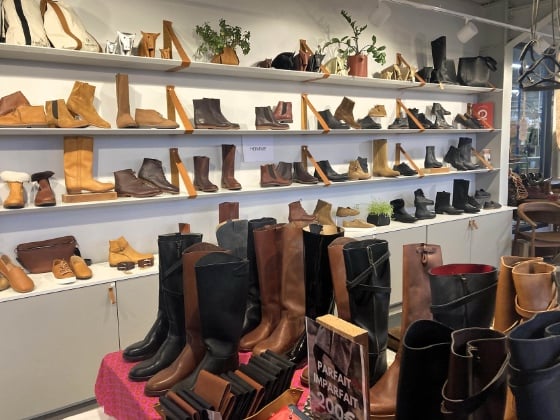 a showroom full of crafted leather boots and shoes