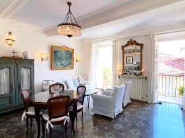 cosy dining and living room looking out over a balcony