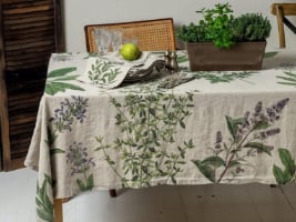 linen table cloth with leaves and flowers covering a table