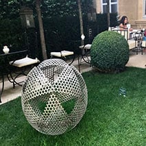 modern art - large spheres on green grass