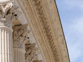 columns meeting a rooftop showing intricate stonework