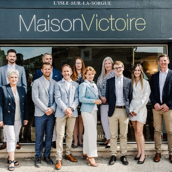 realtors standing in front of Maison Victoire realty building
