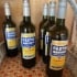 bottles of pastis on a shelf
