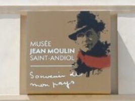 sign for Jean Moulin museum with sketch of the man in a hat