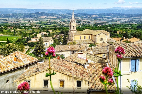 view of countryside with hilltop village in the foreground