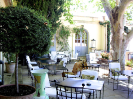 bistro tables and chairs on an outdoor patio