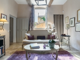 cozy living room with sofa table and pictures on the wall