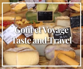 a selection of cheeses on sale at a marketplace with text overlay Goût et Voyage Taste and Travel