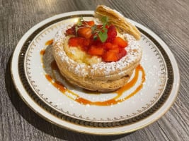 fresh strawberries on a flaky pastry dusted with sugar