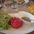 salad, meat, soupbowl on a plate