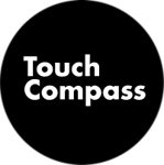 A black circular logo with the words 