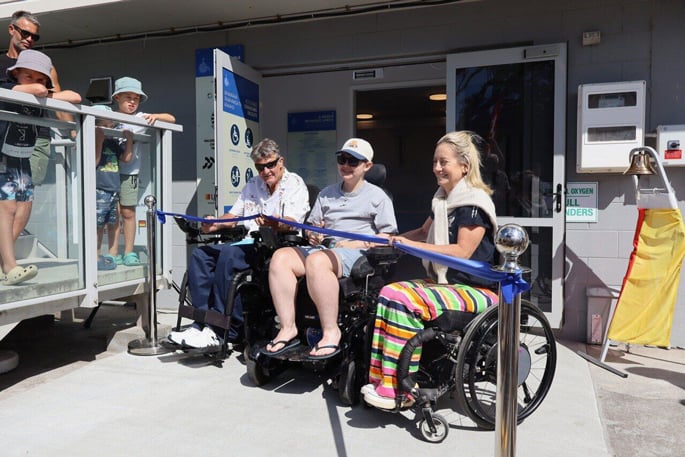 Dave MacCalman, Emmet Schaare and Dame Catriona Williams open the new accessible changing facility at Waihī Beach