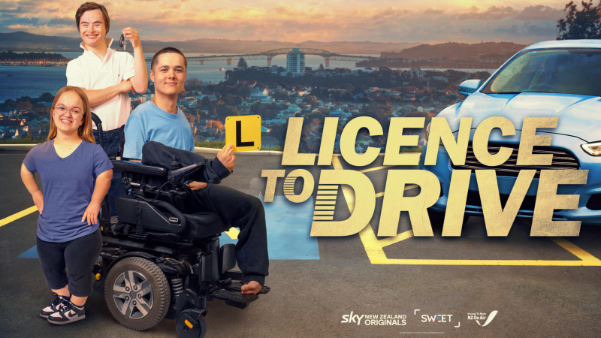 A group of three individuals, including one in a wheelchair, pose in front of a parked car, promoting 