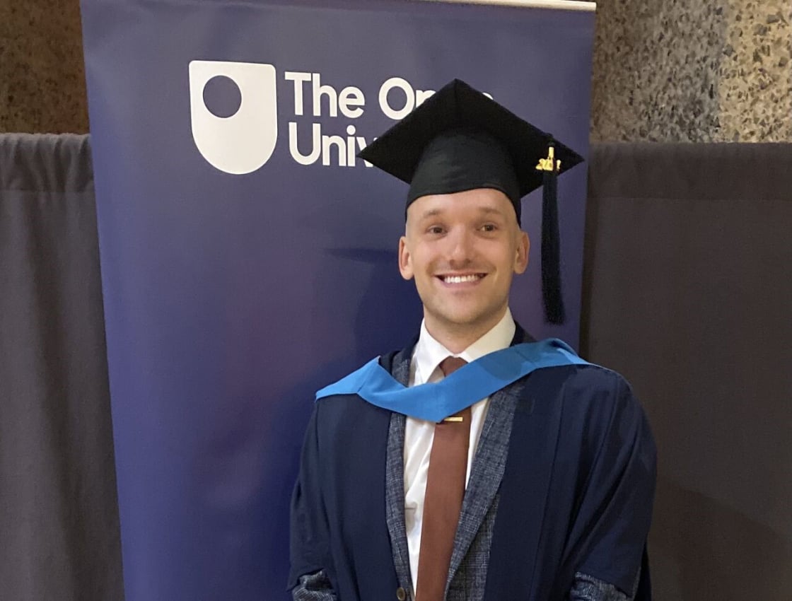 Jake in his graduation gown and cap