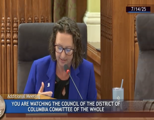 Councilmember Nadeau speaks on the dais of the Council Chamber of the John A Wilson Building