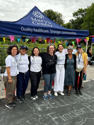 Councilmember Nadeau poses for photo with Mary's Center staff and nurses