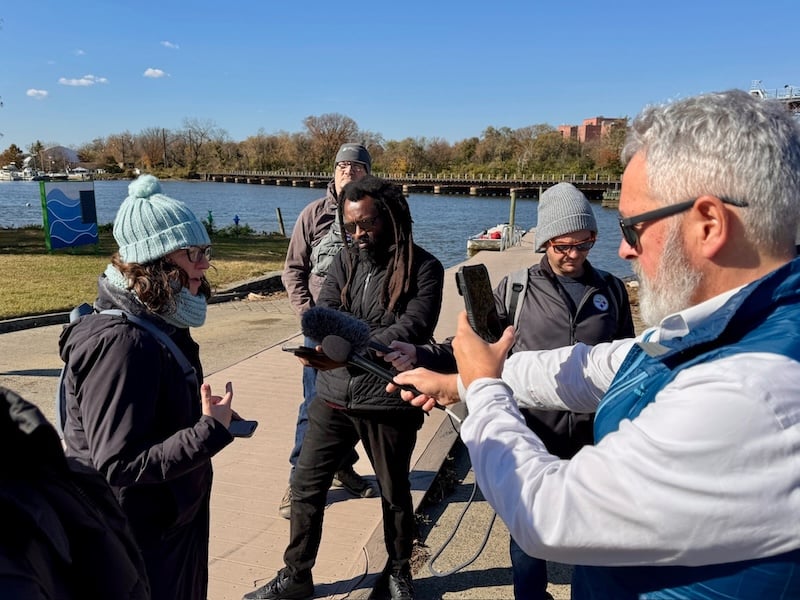 Councilmember Brianne K Nadeau speaks with members of the press on the banks of the Anacostia