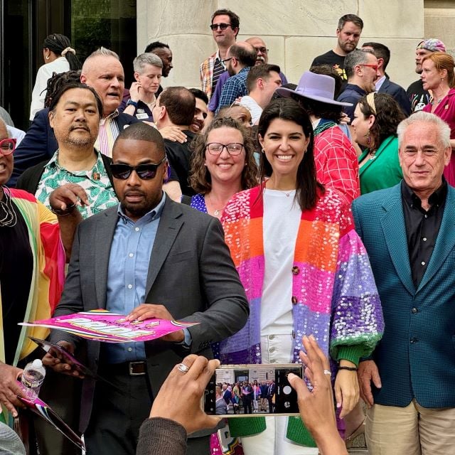 Councilmembers pose for a photo on the Wilson Building steps.