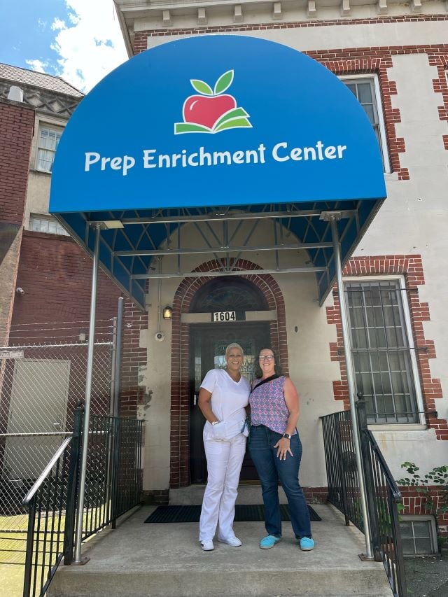 Councilmember Nadeau and CEO Naimah Simkins pose outside the front door of the Prep Enrichment Center
