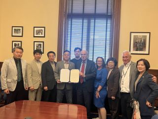 Members of the delegation from South Korea pose for a photo with Chairman Mendelson and councilmembers Nadeau and Frumin.