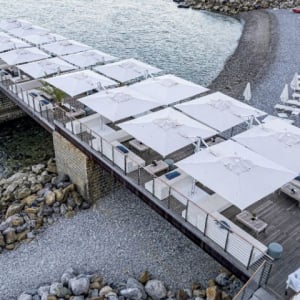 DUAL Double Canopy Umbrellas shown here in a mutiple installation at the seaside.