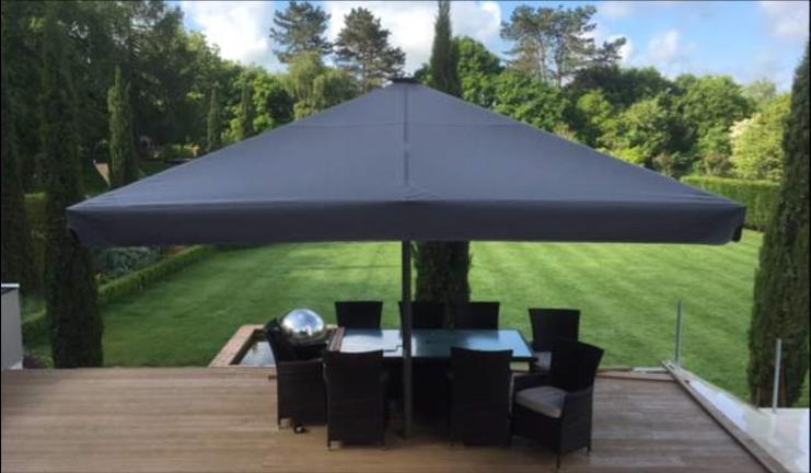 The "GIANT" range of parasols - here we have a plain unbranded version in a summertime residential setting.