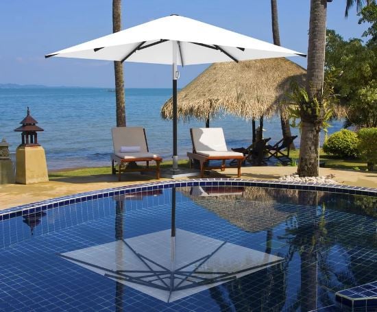 The Atlantic - a high spec premium Summer Parasol shown here installed at the poolside.