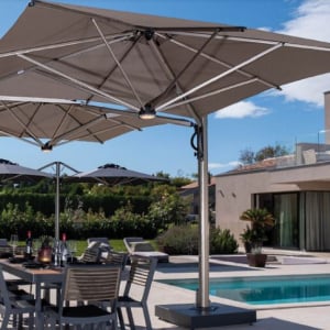 Summertime parasols from Umbrella Heaven. Here we have the "Dual" 2-Way Side Arm Parasol shown here at the poolside.
