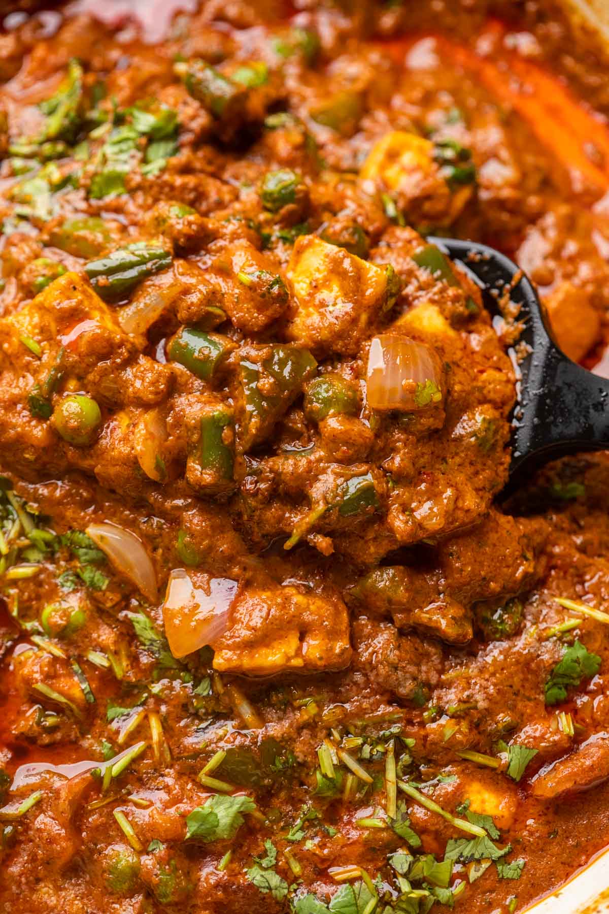 Close up of veg kolhapuri to show the texture of the gravy and crunchy veggies